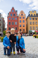Obraz premium Young preschool child, visiting city of Stockholm with his family, sweden