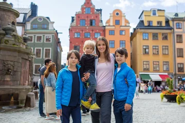 Foto op Aluminium Young preschool child, visiting city of Stockholm with his family, sweden © Tomsickova