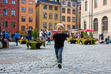 Young preschool child, visiting city of Stockholm with his family, sweden
