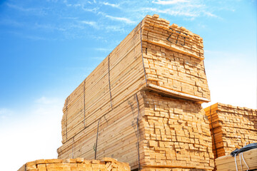 Wooden boards, lumber, industrial wood, timber. Pine wood timber stacked at the port site 