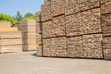 Wooden boards, lumber, industrial wood, timber. Pine wood timber, Scrap timber stacked at the port site 