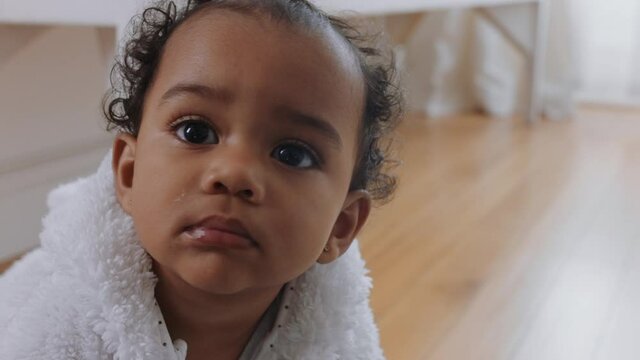 portrait beautiful baby girl looking curious with dummy in mouth happy toddler enjoying life healthy little infant at home