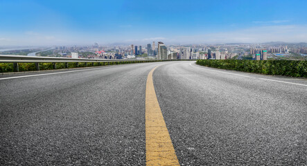 Fototapeta premium Road and city buildings background