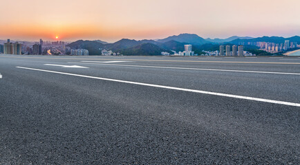 Fototapeta premium Road and city buildings background