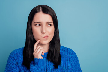 Photo portrait of curious pretty girl looking at empty space thoughtful consider isolated on vivid...