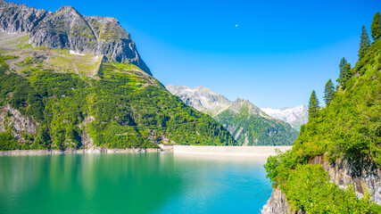 Beautiful alpine walley with azure blue water of Speicher Zillergrundl dam, Zillertal Alps, Austria