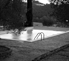 An isolated steel ladder in a swimming pool (Umbria, italy, Europe)