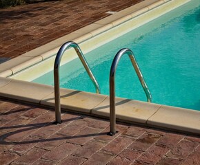 An isolated steel ladder in a swimming pool (Umbria, italy, Europe)