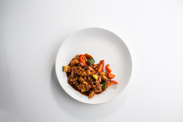 Kung Pao Chicken Gong Bao chinese cuisine with peanuts and onion isolated on white background