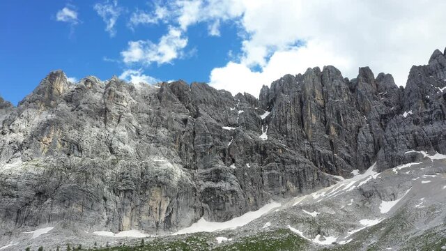 4K aerial Pano shot of flying drone footage of a picturesque Dolomite Alps ridges and peaks. Drone point of view flying up at cca 1923m near Sorapis Lake, Province of Belluno northeastern Italy.