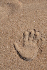 handprint on sand