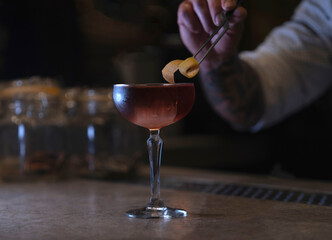 Delicious elegant orange cocktail in top bar restaurant in bogota colombia