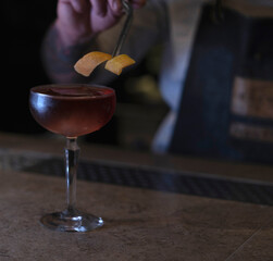 Delicious elegant orange cocktail in top bar restaurant in bogota colombia