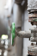 Background. Stopcock and old pipes