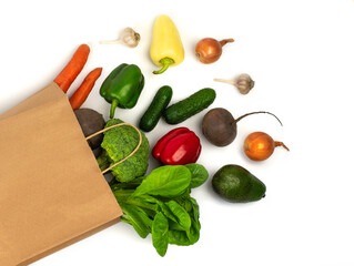 Delivery healthy food background. Vegan vegetarian food in paper bag vegetables and fruits on white, copy space, banner.Grocery shopping food supermarket and clean vegan eating concept.