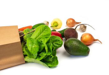 Delivery healthy food background. Vegan vegetarian food in paper bag vegetables and fruits on white, copy space, banner.Grocery shopping food supermarket and clean vegan eating concept.