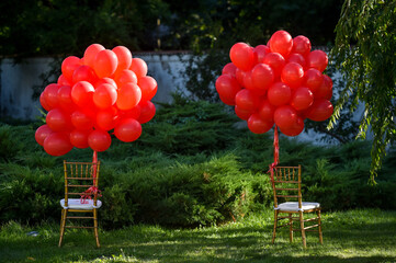 Red balloons, symbol of World Duchenne Awareness Day, are released into the blue open sky.