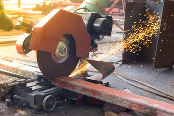 worker cutting steel