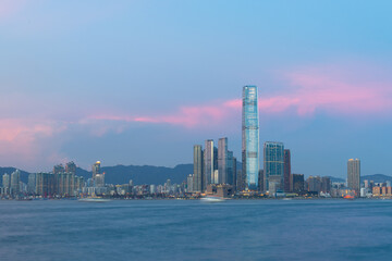 Fototapeta na wymiar sunset view of cityscape of buildings along Victoria Harbour, tsim sha tsui, Kowloon and New territories, Hong Kong