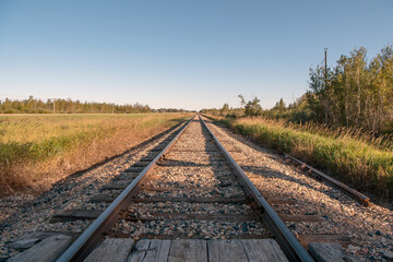 Railroad tracks in rural Saskatchewan on the prairies of Canada.