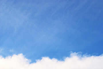 Cloudy day in blue sky background. Natural border in white and blue color of sky and clouds. Blurred soft focus cloud object background.