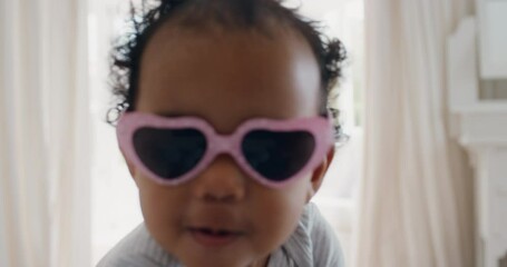 funny baby wearing sunglasses happy toddler having fun cute infant enjoying silly humor at home 4k