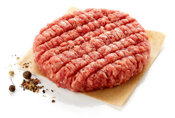 Raw hamburger patty isolated on white