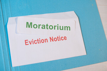 Concept showing Moratorium for evictions by showing eviction notice on table during coronavirus or...