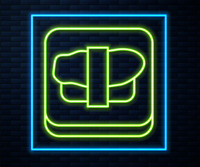 Glowing neon line Sushi on cutting board icon isolated on brick wall background. Asian food sushi on wooden board. Vector
