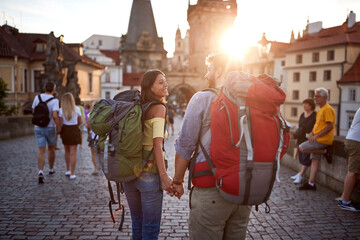 Happy tourist couple sightseeing; Traveller lifestyle