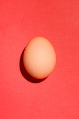 Top view of traditional red easter eggs on red background.