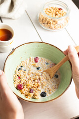 Healthy breakfast with muesli with milk and fruits