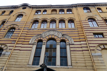 Fototapeta na wymiar Beautiful building of the Faculty of Theology at Sofia University, built in 1923 on Sveta Nedelya or Square in the center of city, Bulgaria 