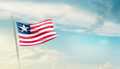 Liberia national flag cloth fabric waving on the sky - Image