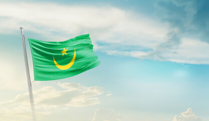 Mauritania national flag cloth fabric waving on the sky - Image