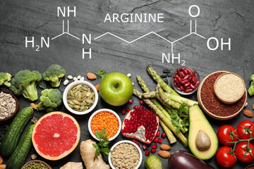 Fresh vegetables, fruits and seeds on black table, flat lay. Sources of essential amino acids