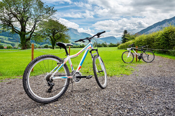 Fototapeta na wymiar Bikes and in the background the amazing Switzerland landscape