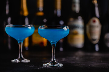 Blue cocktail / wine / champagne on a dark table