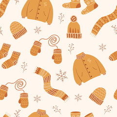 Seamless pattern with winter clothing. Christmas pattern. New Year's pattern with children's things for textiles and design of packaging, gifts, decoration of holiday pages. Knitted clothes.