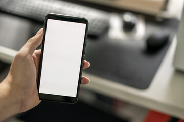 Man using smartphone mockup with white screen