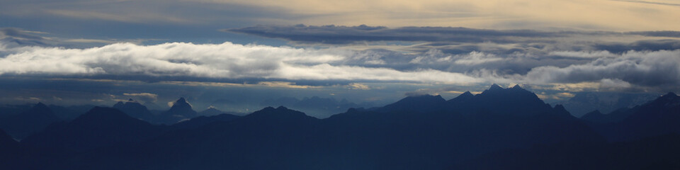 Moody sky over Mount Grosser Mythen and other mountains of the Swiss Alps.