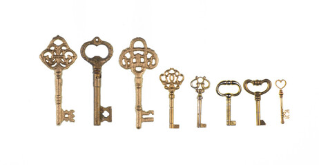 collection of ancient golden keys isolated on white background