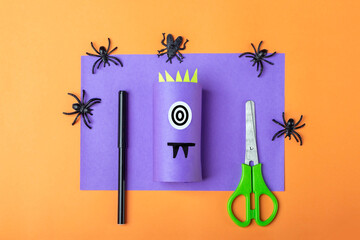 Halloween DIY and kids creativity. Step by step instruction: making purple monster from toilet roll...