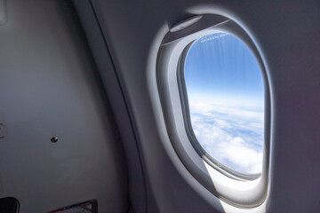 Airplane window cloud and blue sky