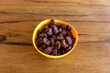 Pouring milk into chocolate cornflakes balls Breakfast with milk and cornflakes.