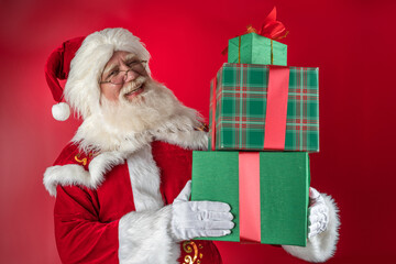 Emotional senior male model old man with a natural white beard in the role of Father Christmas