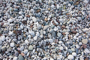 Pile of colorful stones on beach.