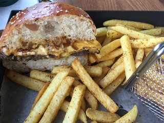 Hand made burger beef patty inside and spicy french fries