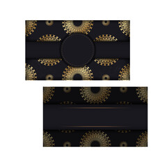 Obraz na płótnie Canvas Black color greeting card template with golden abstract pattern
