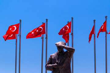 Marmaris, Turkey. Monument to Ataturk on the embankment and flags of Turkey. - 456255995